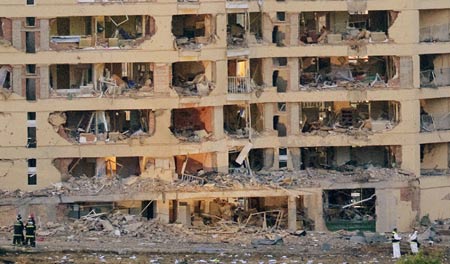 Investigators view damage to a Civil Guard barracks after a car bomb exploded in the northern Spanish city of Burgos, early July 29, 2009.At least 46 people were slightly injured, according to emergency services. Part of the barracks facade collapsed into the street when the bomb went off around 4.30 a.m. (0230 GMT). A spokeswoman for the Civil Guard, Spain's paramilitary police force, said the attack was probably carried out by Basque separatist rebels ETA.[Xinhua/Reuters]