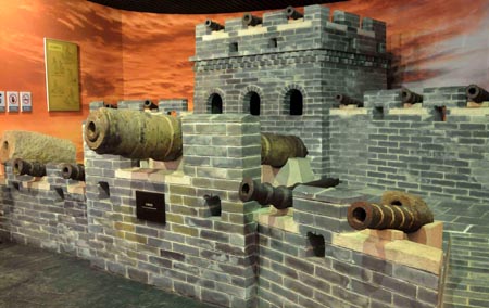 The ancient cannons are exhibited at the Shanhaiguan Great Wall Museum in Qinhuangdao of north China's Hebei Province, July 20, 2009. The Shanhaiguan Great Wall Museum opened to public for free on Wednesday after the reconstruction which costed over 40 million yuan (about 5.8 million U.S. dollars). The museum, regarded as the 'Great Wall encyclopedia', elaborates the Great Wall about its history, construction and culture by presenting the cultural relics, sculptures, pictures and models. [Xinhua]