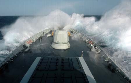 Chinese naval 'Xuzhou' missile frigate sails in the roaring Arabian sea, the Indian Ocean on July 28, 2009. The Chinese Naval Escort Fleets encountered monstrous waves in the Arabian Sea on July 28. The fleet changed its course accordingly and safely passed the stormy area at 16:00 Beijing time, July 29, 2009. [Xinhua]