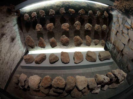 Stones of the Guyang Great Wall during the Qin Dynasty (221-207 B.C.) are exhibited at the Shanhaiguan Great Wall Museum in Qinhuangdao of north China's Hebei Province, July 20, 2009. [Li Yong/Xinhua]