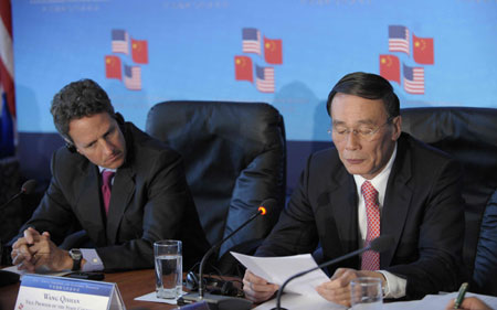 Chinese Vice Premier Wang Qishan (R) and U.S. Treasury Secretary Timothy Geithner co-chair the "Economic Track" of the China-U.S. Strategic and Economic Dialogue (S&ED) at the U.S. Treasury Department in Washington, July 28, 2009.(Xinhua/Zhang Yan)