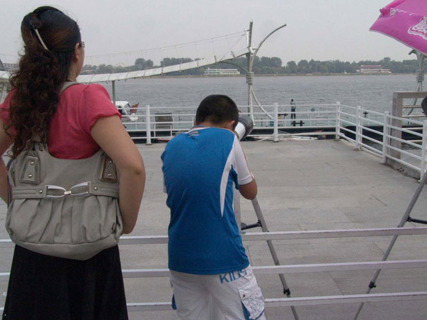 For about three yuan, you can take a few minutes to peek across the river to the Northern border of North Korea. Don't expect to see much more than warehouses and a couple of North Koreans fishing or farming, but a look is worthwhile for people who are curious about the secretive nation. 