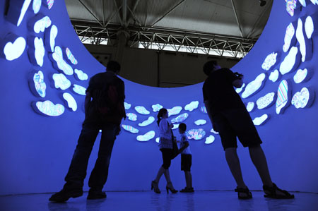 People view an installation at the fourth Chengdu Biennial Exhibition in Chengdu, capital of southwest China's Sichuan Province, July 29, 2009. (Xinhua/Jiang Hongjing)