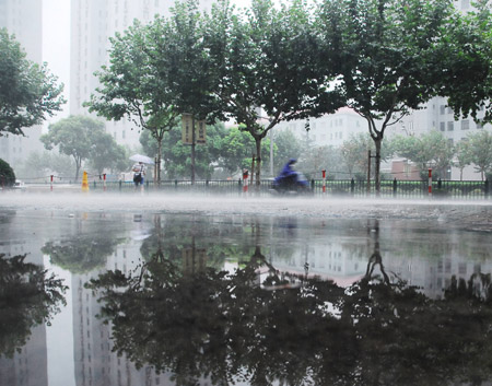 The photo taken on July 30, 2009 shows a section of a flooded street in Shanghai, China. [Xinhua]