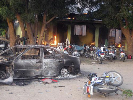 The wreckage of motorcycles next to a burnt-out house of Islamist extremists in northern Nigeria on July 30, 2009. More than 600 people have been killed during clashes between Islamist extremists and security forces in a city in northeastern Nigeria, witnesses have said.[Xinhua/AFP]