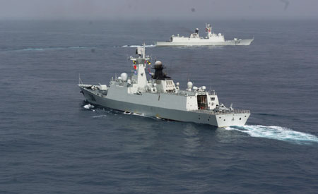 Zhoushan and Xuzhou (front) missile frigates change directions to join the Second Chinese naval escort on the Gulf of Aden, July 30, 2009. Two frigates and a supply ship from the Chinese navy, on another escort mission to fend off Somali pirates, joined with the second naval escort on Thursday.[Guo Gang/Xinhua]