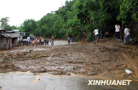 Photo taken on July 27, 2009. Twenty-four were confirmed dead and four missing after downpours triggered havoc Monday in Miyi County, Panzhihua City, said the city government. Another 44 were injured.