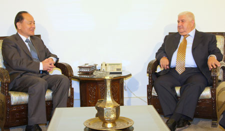 Visiting China's speicial envoy on Middle East affairs Wu Sike (L) meets with Syrian Foreign Minister Walid Mualem in Damascus, capital of Syria, July 30, 2009. (Xinhua/Gong Zhenxi)