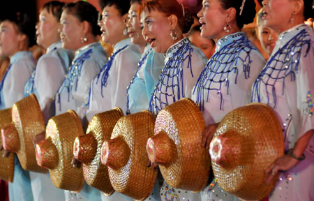 Actresses perform during a fishermen's festival in Lingao, a county of south China's Hainan Province, July 30, 2009. A festival was held here on Thursday as the midsummer moratorium on fishing in the South China Sea was ending. 