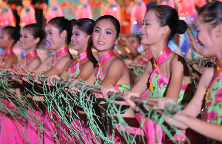 Actresses perform during a fishermen's festival in Lingao, a county of south China's Hainan Province, July 30, 2009. A festival was held here on Thursday as the midsummer moratorium on fishing in the South China Sea was ending. 