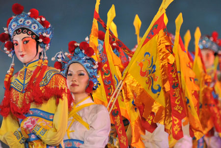  An actress performs puppet show during a fishermen's festival in Lingao, a county of south China's Hainan Province, July 30, 2009. A festival was held here on Thursday as the midsummer moratorium on fishing in the South China Sea was ending. 