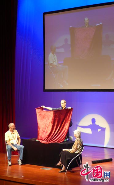 A magician competes on stage in Beijing at the FISM World Championships of Magic. The conference attracts professional magicians from all around the world and is held every three years in a different city. [Yan Xiaoqing/China.org.cn]