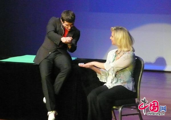 A magician competes on stage in Beijing at the FISM World Championships of Magic. The conference attracts professional magicians from all around the world and is held every three years in a different city. [Yan Xiaoqing/China.org.cn]