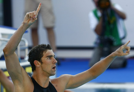Michael Phelps of the U.S. celebrates after winning the men's 100m butterfly final at the 13th FINA World Championships in Rome, Aug. 1, 2009. Michael Phelps won the gold and broke the world record with 49.82. (Xinhua/Zhang Yuwei)