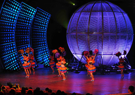 Performers dance during a 'Happy Stage' show at the Puppet Theater in Beijing, capital of China, Aug. 1, 2009. 
