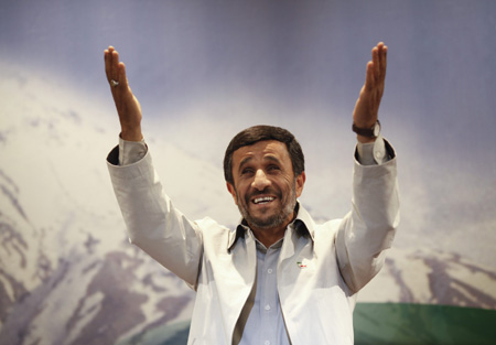 Iranian President Mahmoud Ahmadinejad gestures to journalists as he attends his first news conference after Iran's presidential election in Tehran, June 14, 2009.[Xinhua/Reuters]