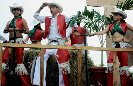 Contestants participate in a beauty contest of cowgirls to mark the traditional San Sebastian festival in Diriamba, southern agriculture and animal husbandry city of Nicaragua, Aug. 3, 2009. [Jairo Cajin/Xinhua]