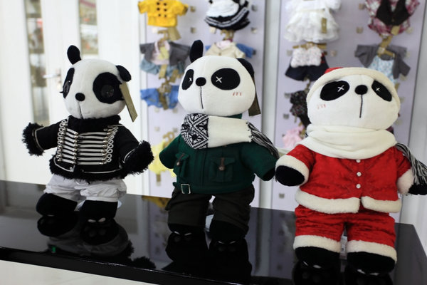 Panda Town toys are displayed in a store on August 2, 2009 in Beijing, China. The Panda Town brand is established by some youth who were born in the 1980's and came back from study abroad. They use Chinese element to decorate the panda toys and to make the brand famous as Barbie in American. (Photo by ChinaFotoPress)