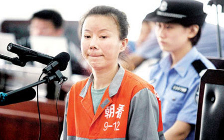 Man Wenjun's wife, Li Li is seen on trial in Beijing Monday.