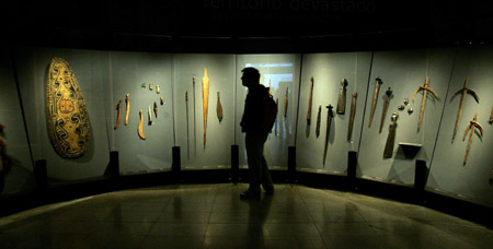 A man visits the 'Kuhane Rapa Nui in the Pacific Islands' at the Central of Cultura of the Palacio of Moneda in Chile on Aug. 3, 2009. The show displays over 300 pieces of art from Tahiti, the Marquesas Islands and Rapa Nui, in Polynesia, New Guinea and Fiji Islands in Melanesia, as well as New Zealand and Australia, among other enclaves in the South Pacific.
