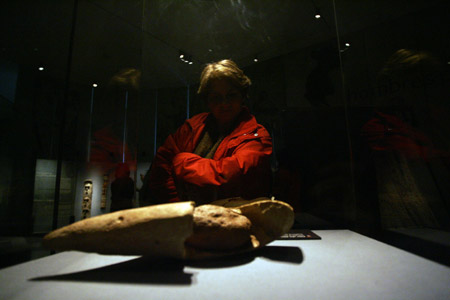 A woman visits the 'Kuhane Rapa Nui in the Pacific Islands' at the Central of Cultura of the Palacio of Moneda in Chile on Aug. 3, 2009. The show displays over 300 pieces of art from Tahiti, the Marquesas Islands and Rapa Nui, in Polynesia, New Guinea and Fiji Islands in Melanesia, as well as New Zealand and Australia, among other enclaves in the South Pacific.
