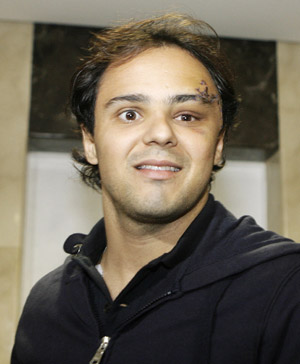 Brazilian Formula One driver Felipe Massa of the Ferrari team poses for photographers as he arrives at Hospital in Sao Paulo August 3, 2009. Massa suffered a head injury on July 25 at the qualifying for the Hungarian Grand Prix and spent several days in a coma and on a respirator.