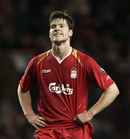 Liverpool's Xabi Alonso reacts after Benfica's Fabrizio Miccoli (unseen) scored during their Champions League first knockout round second leg soccer match at Anfield in Liverpool, northern England, March 8, 2006. 