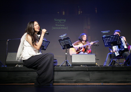 Wanfang performing on stage.