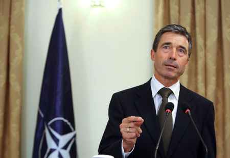 New NATO Secretary-General Anders Fogh Rasmussen speaks during a joint press conference with Afghan President Hamid Karzai (not pictured) at the presidential palace in Kabul August 5, 2009. Anders Fogh Rasmussen arrived in Kabul on Wednesday to meet with Afghan officials. [Xinhua]