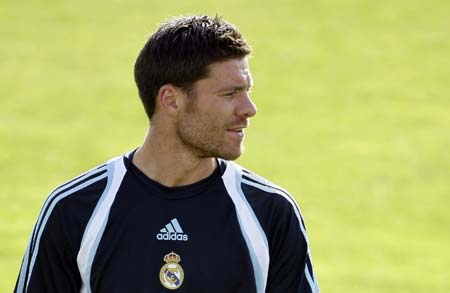 Real Madrid's Xabi Alonso attends his first training session at Valdebebas training grounds outside Madrid August 5, 2009. Real Madrid have ended their search for new signings with the deal to land Spain midfielder Xabi Alonso from Liverpool and will now focus on trimming their squad, director general Jorge Valdano said on Wednesday.