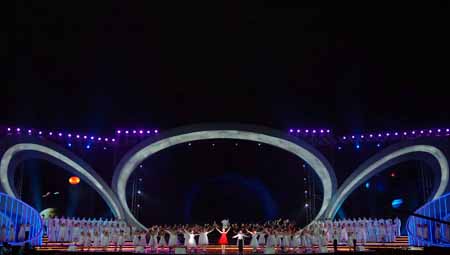 Children perform in a musical concert at Beijing Olympic Forest Park to commemorate the first anniversary of Beijing 2008 Olympic Games in Beijing, capital of China, August 6, 2009.[Xinhua]