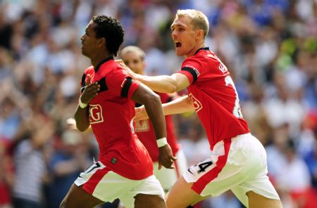 Manchester United's Nani (L) celebrates with team mate Darren Fletcher after scoring against Chelsea during their English Community Shield soccer match at Wembley Stadium in London August 9, 2009.(Xinhua/Reuters Photo) 