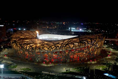 Photo taken on Aug. 22, 2008 shows the nightscape of the National Stadium, also known as the Bird's Nest, in Beijing, capital of China. The Olympic Green enjoys a beautiful night view shining with colors and lights during the Beijing 2008 Olympic Games. [Wang Wen/Xinhua]