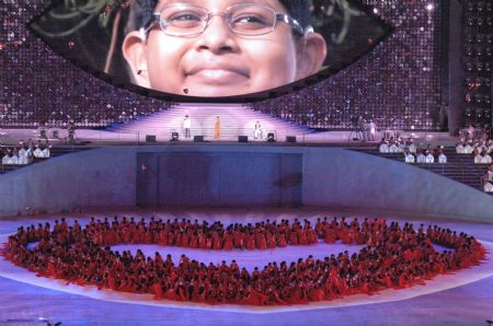 Artists perform during the national day celebration in Singapore, Aug. 9, 2009. Singapore, a city state with a population of 4.84 million, marked its 44th birthday with a massive party at the Marina Bay floating platform on Sunday night.[Zhang Yongxing/Xinhua]