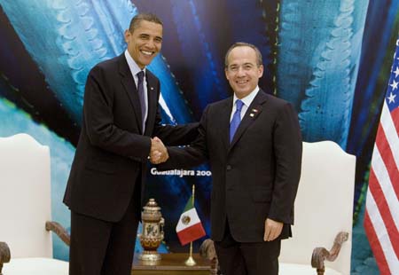  U.S. President Barack Obama (L) and Mexico's President Felipe Calderon shake hands while they hold a bilateral meeting at the Cabanas Cultural Center in Guadalajara while attending the North American Leaders' Summit, August 9, 2009.[Xinhua/Reuters]