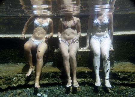 Psoriasis patients relax in a hot spa pool as part of a treatment process, in Kangal 105 kilometers (65 miles) south of the central Anatolian city of Sivas August 9, 2009. 