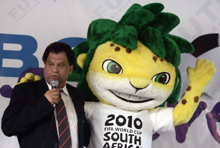 Daany Jordaan, chief of the organising committee of the 2010 FIFA World Cup South Africa, speaks beside the official mascot Zakumi during a visit to participants of the Football Forever program in the city of Soyapango, 12 km (7 miles) east of San Salvador, August 10, 2009.