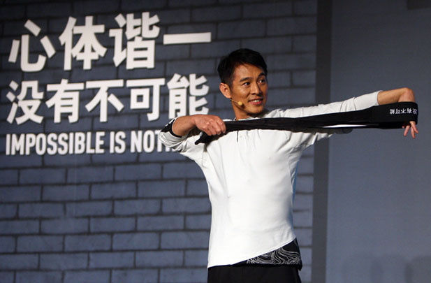 Jet Li gestures at a promotional event for his body training program on August 5, 2009, in Beijing.