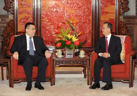 Chinese Premier Wen Jiabao (R) meets with Chui Sai On, the new chief executive of the Macao Special Administrative Region (SAR), in Beijing, capital of China, on Aug. 11, 2009. Wen awarded the instrument of appointment as the new chief executive of the Macao SAR to Chui Sai On on Tuesday.