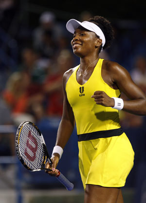 Venus Williams of the U.S. celebrates after defeating Olga Govortsova of Belarus in their second round match at the Cincinnati Women's Open tennis tournament in Cincinnati, Ohio, August 11, 2009.