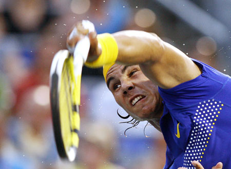 Rafael Nadal of Spain serves to compatriot David Ferrer at the Rogers Cup tennis tournament in Montreal August 12, 2009.