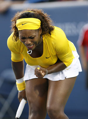 Serena Williams of the U.S. reacts after making her shot against Kateryna Bondarenko of Ukraine during their second round match of the 2009 Cincinnati Women's Open tennis tournament August 12, 2009.