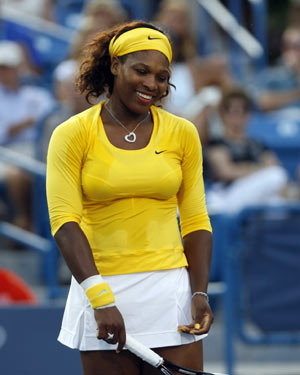 Serena Williams of the U.S. reacts after missing a shot against Kateryna Bondarenko of Ukraine during their second round match of the 2009 Cincinnati Women's Open tennis tournament in Cincinnati, August 12, 2009.