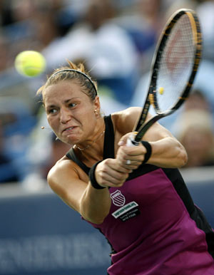 Kateryna Bondarenko of Ukraine returns a volley to Serena Williams of the U.S. during their second round match of the 2009 Cincinnati Women's Open tennis tournament August 12, 2009.