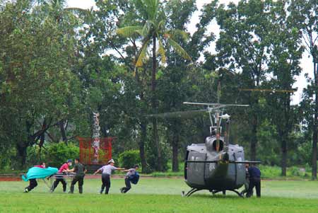 A helicopter prepares to take off to rescue trapped residents in Kaohsiung county of south China's Taiwan Province, Aug. 11, 2009. Helicopters rescued many residents trapped by flood and mudslide caused by Typhoon Morakot on Tuesday morning as the weather became clear. The death toll in Taiwan after typhoon Morakot swept across the island surged to 103 as of 9 p.m. Wednesday after rescuers found 32 bodies in southern Kaohsiung County, local media reported. [Chen Jianxing/Xinhua]