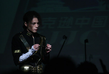 A singer sings a song by the deceased American singer Michael Jackson at a charity concert held in the Star Live in Beijing, capital of China, August 12, 2009.