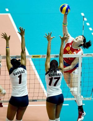 China's Wang Yimei (R) smashes the ball during the match against Dominica at the FIVB World Grand Prix women's volleyball tournament in Hong Kong, south China, Aug. 14, 2009. The game is still going on.(