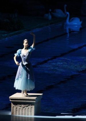 A member of the Russian Imperial Ballet stands on a former starting block as she performs Swan Lake at the Beijing Olympics swimming competition pool at the National Aquatics Centre, also known as the Water Cube, in Beijing August 13, 2009. China was determined to have iconic venues like the Water Cube aquatics centre and the Bird's Nest stadium for their first hosting of the Olympic Games, but were also keen to avoid leaving a legacy of white elephants dotting the city.(Photo Source:chinadaily.com)