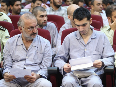 Iranian suspects sit in a courtroom in Tehran August 16, 2009. Iran began its third mass trial on Sunday of people accused of fomenting the unrest that erupted after the disputed June presidential election, Iranian media reported.