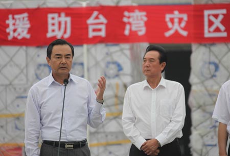  Wang Yi, director of the Taiwan Work Office of the Communist Party of China (CPC) Central Committee, expresses his condolence on Taiwan people's loss during a start sending ceremony at the Beijing Capital International Airport, China, on Aug. 18, 2009.
